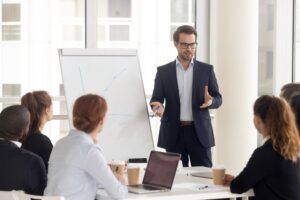 Man standing in front of a flip chart